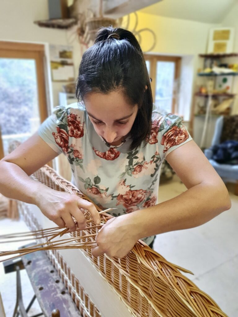 Contact photo: Steph weaving the coffin lid border