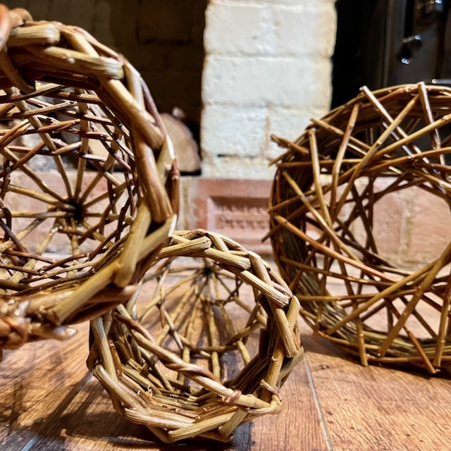 Round and tapered fat ball bird feeders displayed showing spiral patterns down them
